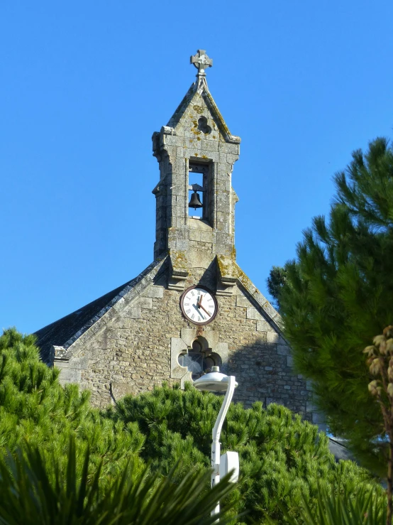 an old church with a clock and bell tower