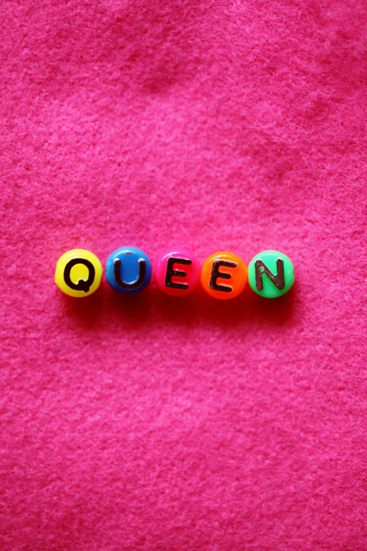 the word queen spelled in spelled out with colored letters