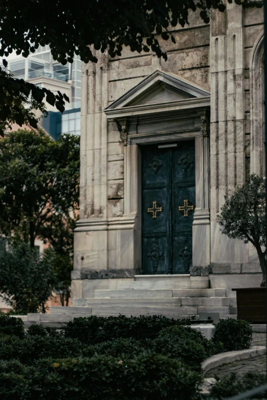 a picture of a stone building with a green door