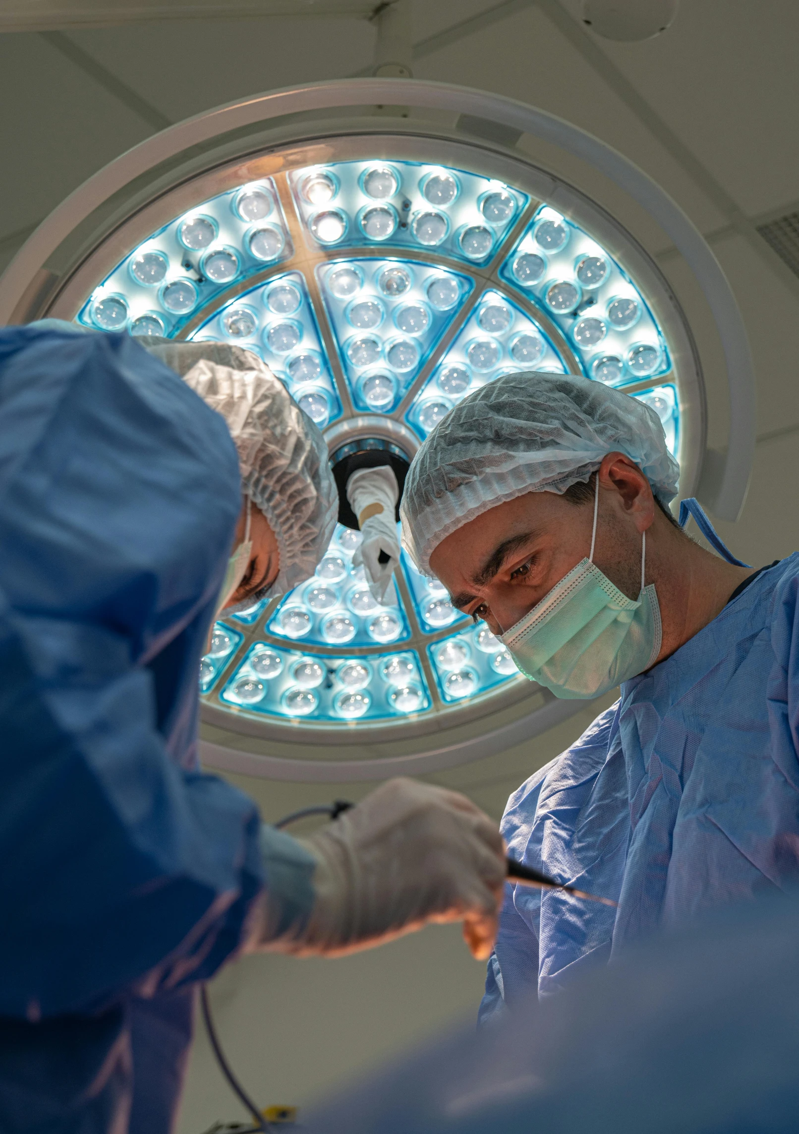 two surgeons and one doctor in operating room