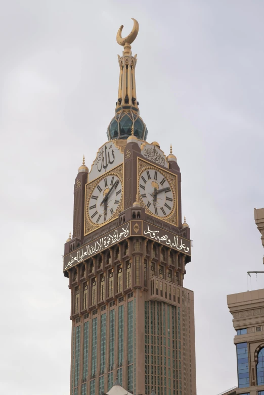 an ornate clock tower next to another building