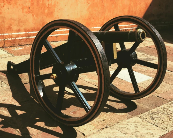 a cannon is placed on a tiled floor