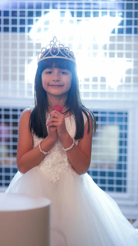 a small child is wearing a flower crown