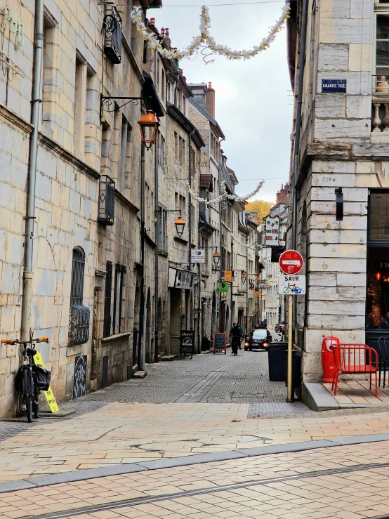 a paved street with many tall buildings in it