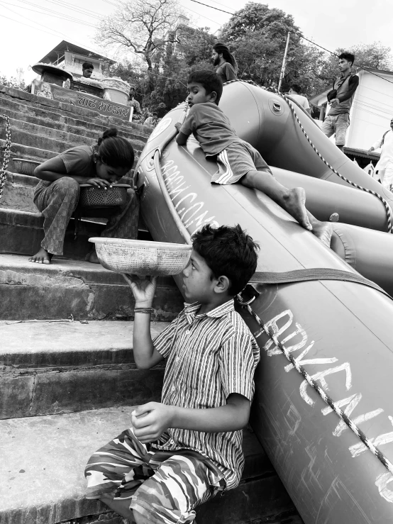 a  holding an object sitting on top of a slide