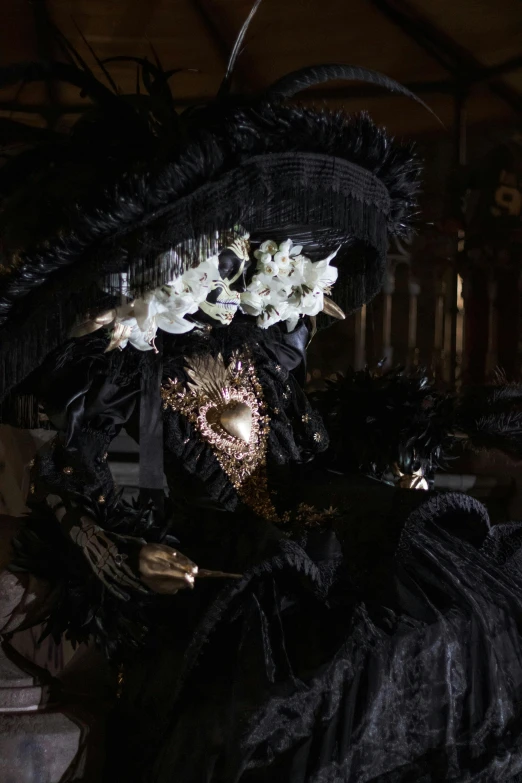 a black woman's mask with flowers