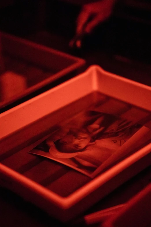 a picture is placed on a tray under a table