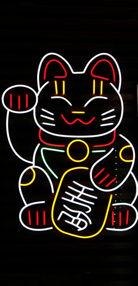 a lighted sign depicting the chinese character for lucky cat