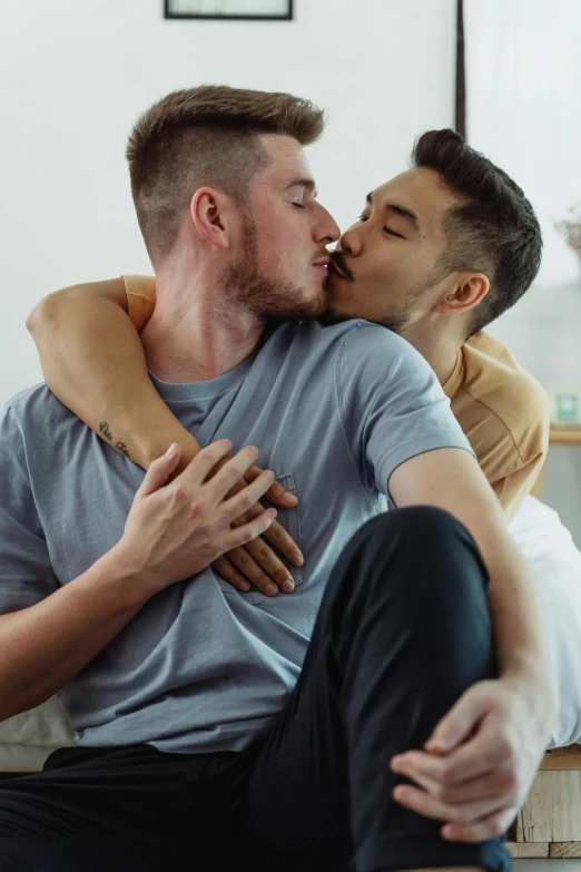 man and woman kissing on the floor