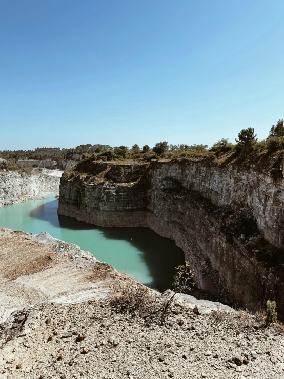 a large body of water that is surrounded by rocks