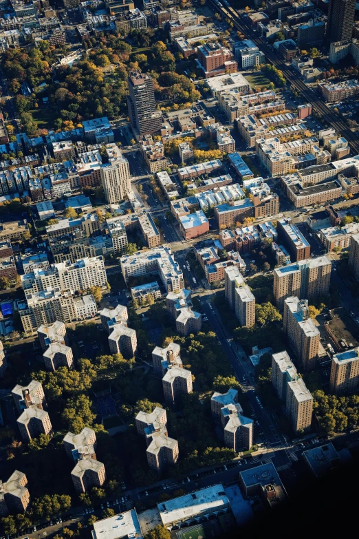 the aerial view of city area with many tall buildings