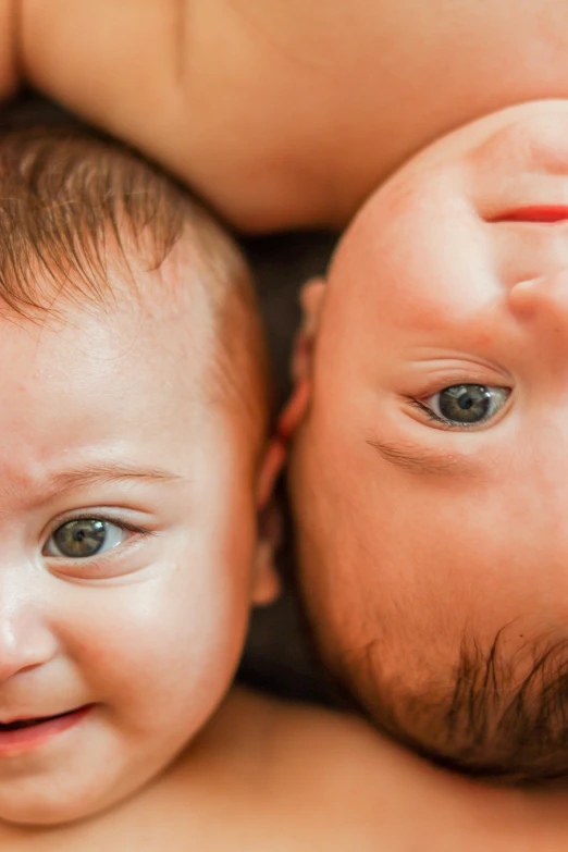 two babies looking up and having a good time