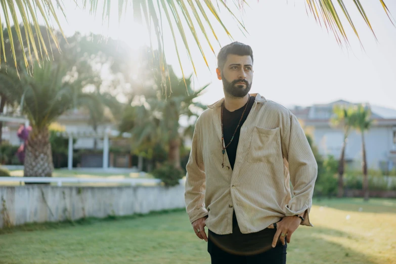 a man is outside posing for the camera