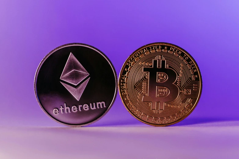 ether, a bitcoin, and ether coin on purple background