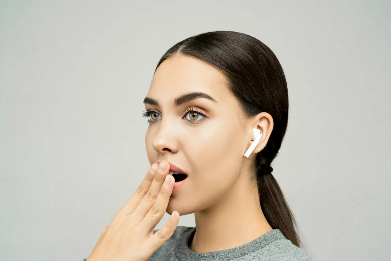 a woman with ear buds on her ears