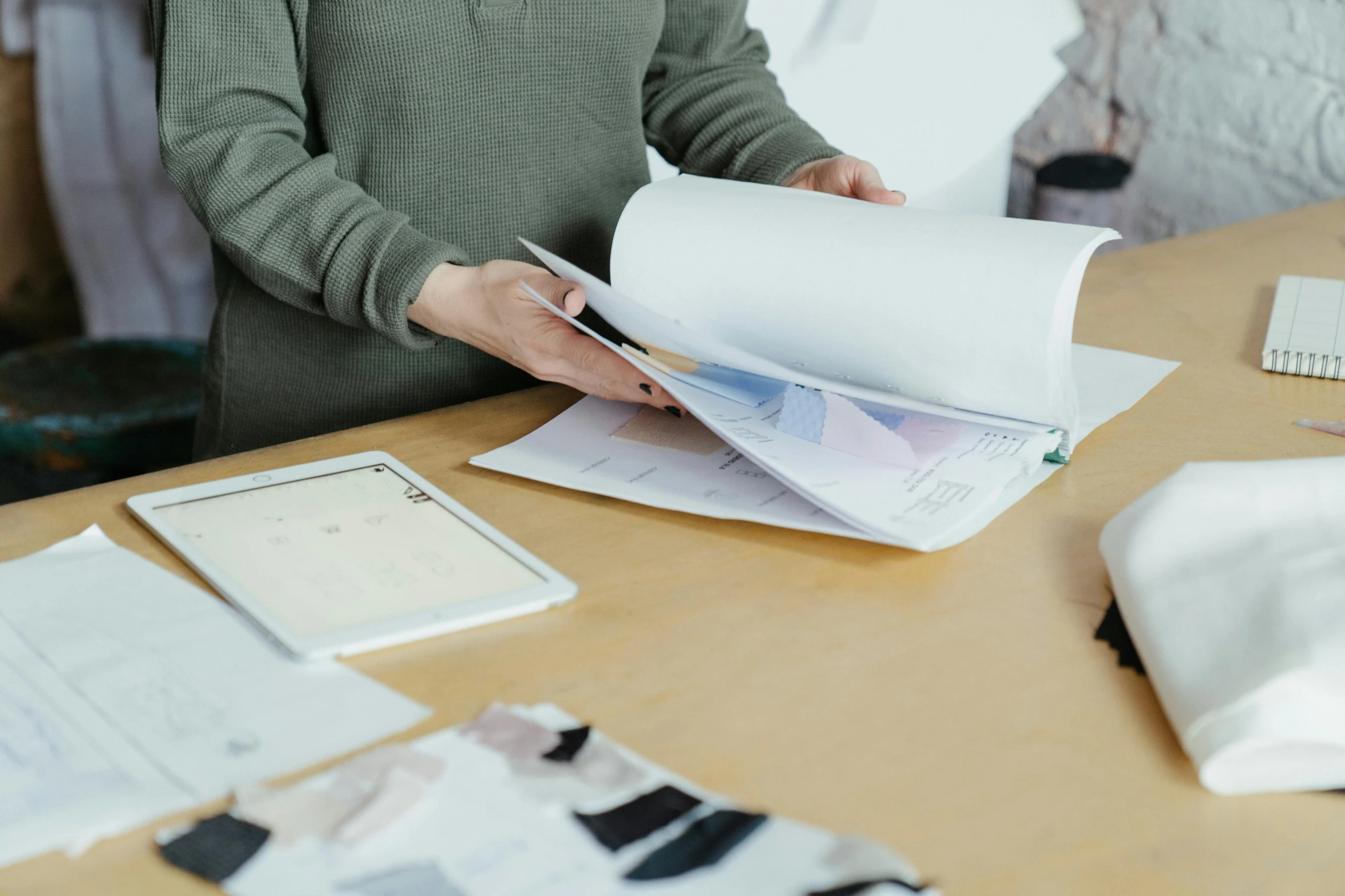 a person is working on a piece of paper