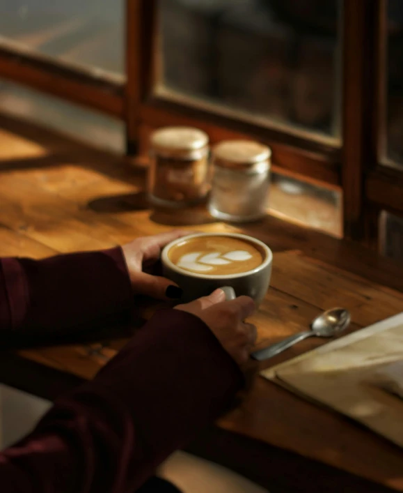 a person sits at a table with some drinks