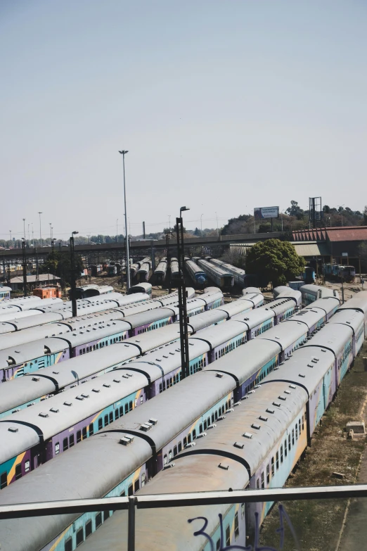 there is an image of many trains parked in the station