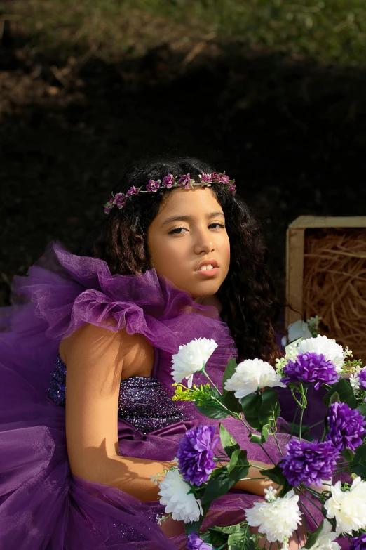 an adorable  in a flower - adorned dress