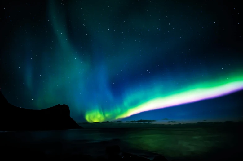 an aurora bore lights up the night sky