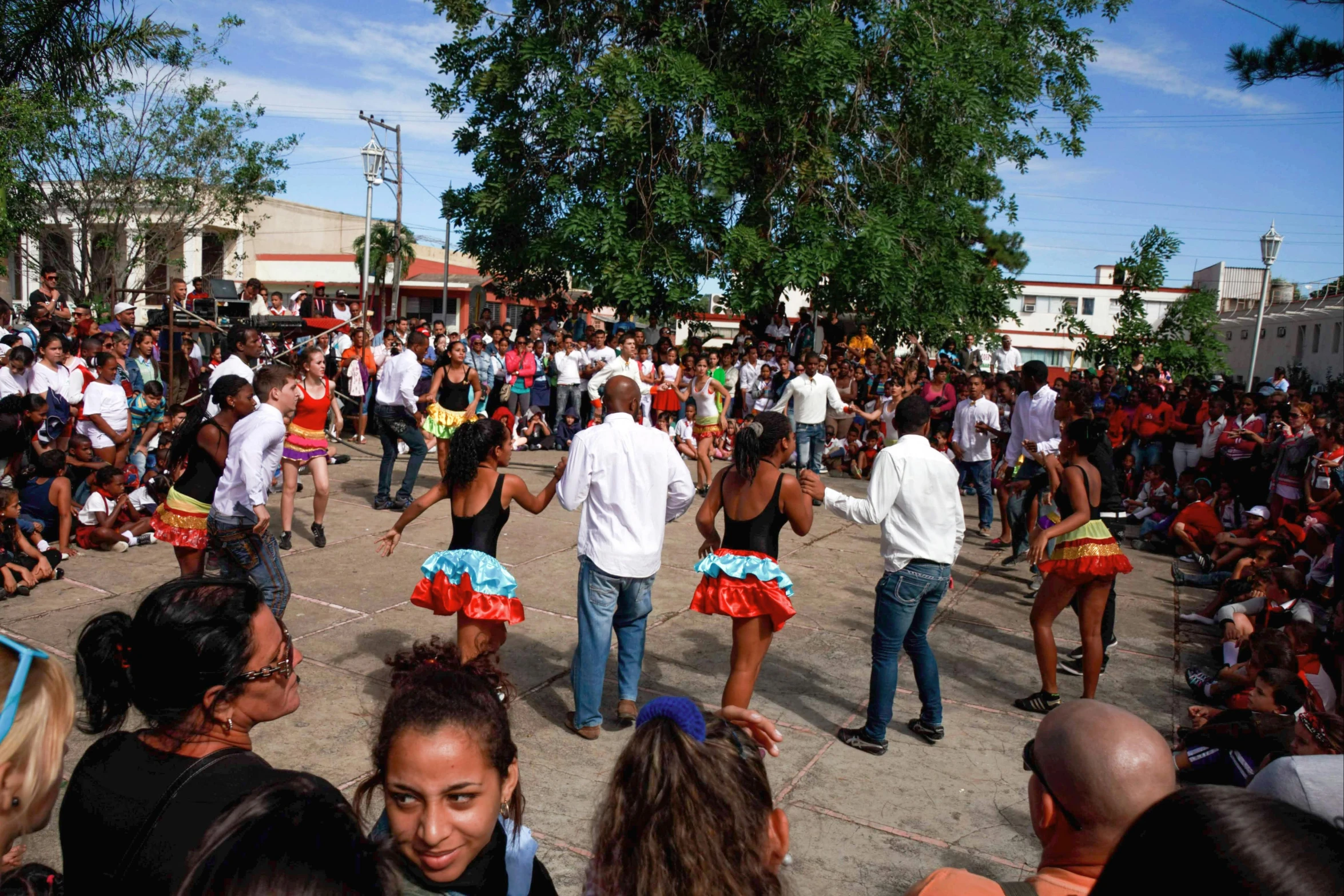 a group of people performing different cultural dances