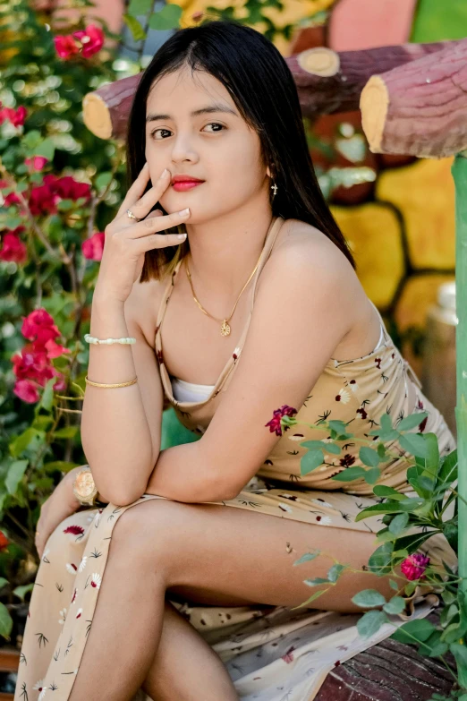 a young woman posing for a po on her bench