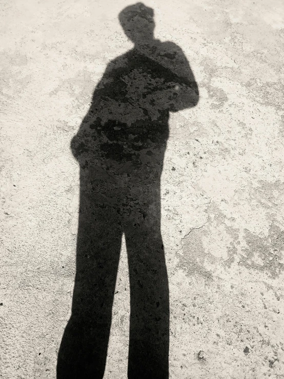 a man standing in the middle of a black and white picture