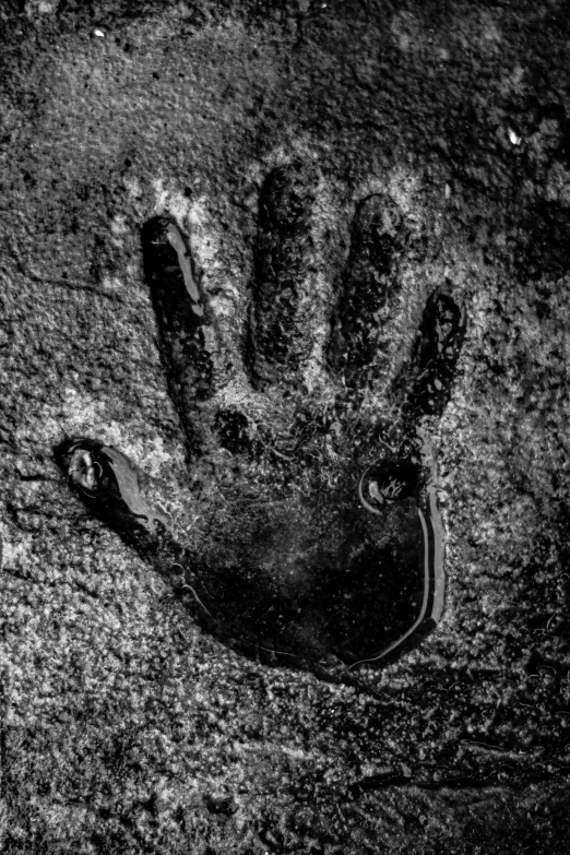 a black and white po of a hand print