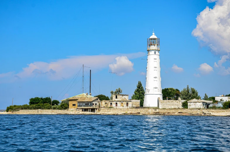 the lighthouse is in the middle of the water