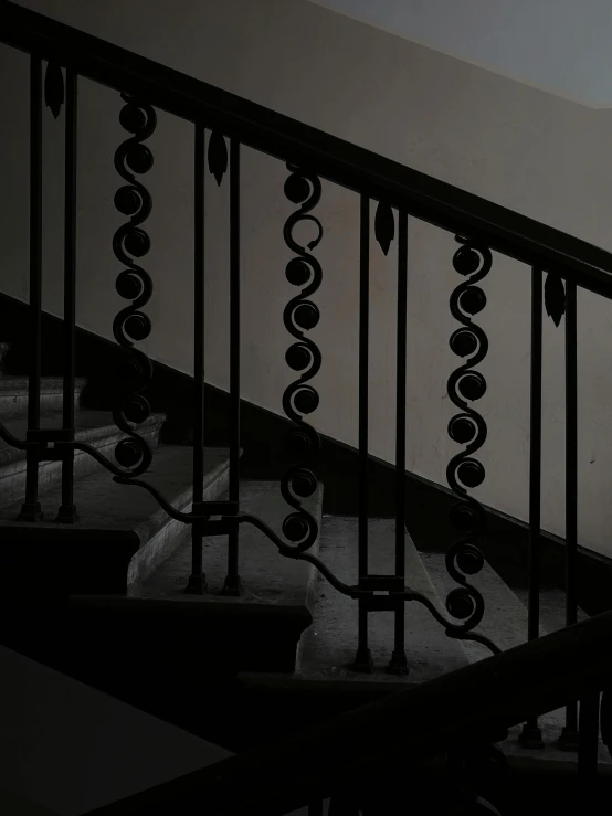 the top view of an iron and glass stair rail