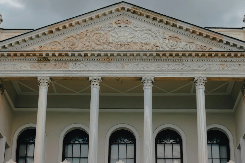 an ornate building with double columns and pillars