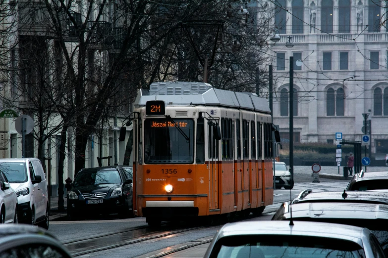 traffic moves down the road in a city