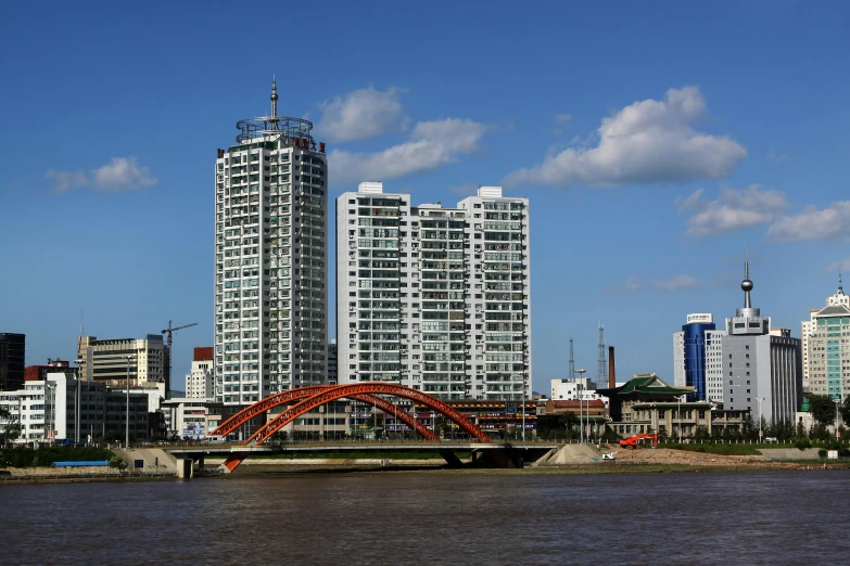 large buildings in the background next to an ocean