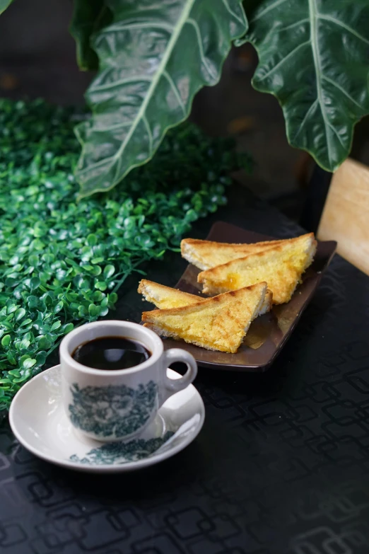 bread wedges are displayed next to cup of coffee