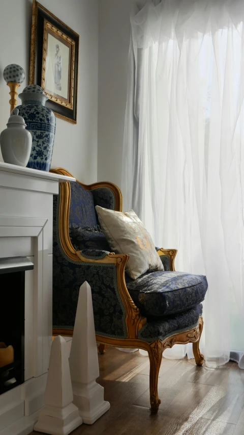 a living room with a chair and a fire place