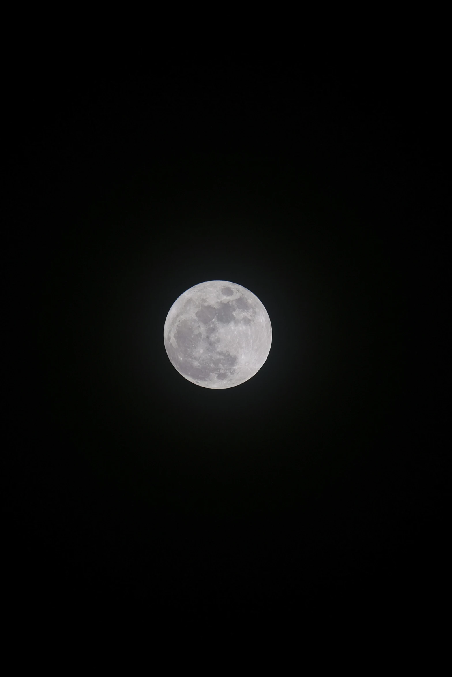 an airplane flying in the air with a half moon