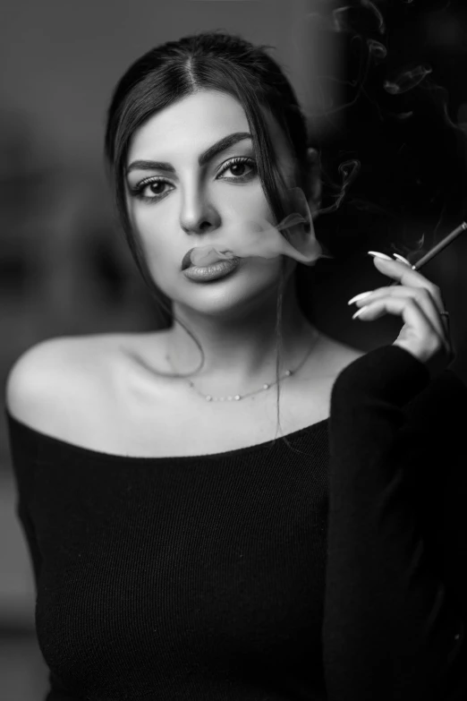 black and white po of a woman smoking a cigarette