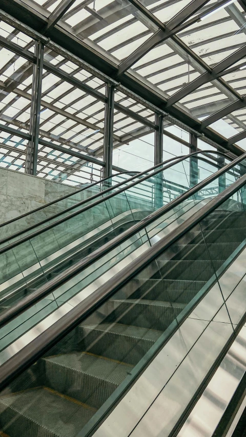 the escalator has a glass bottom panel