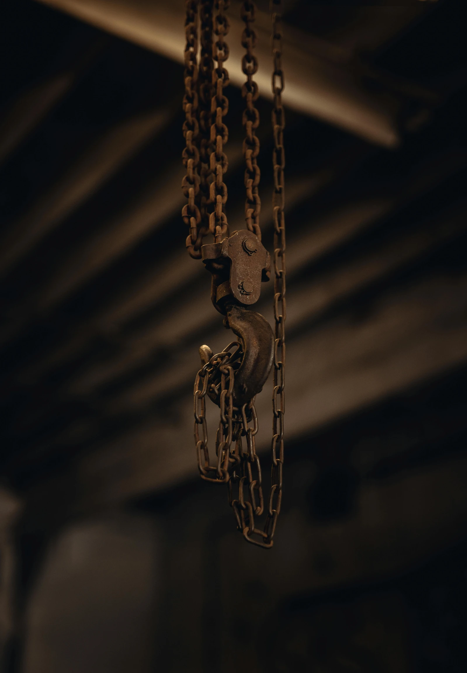 a chain with three chains hanging from it