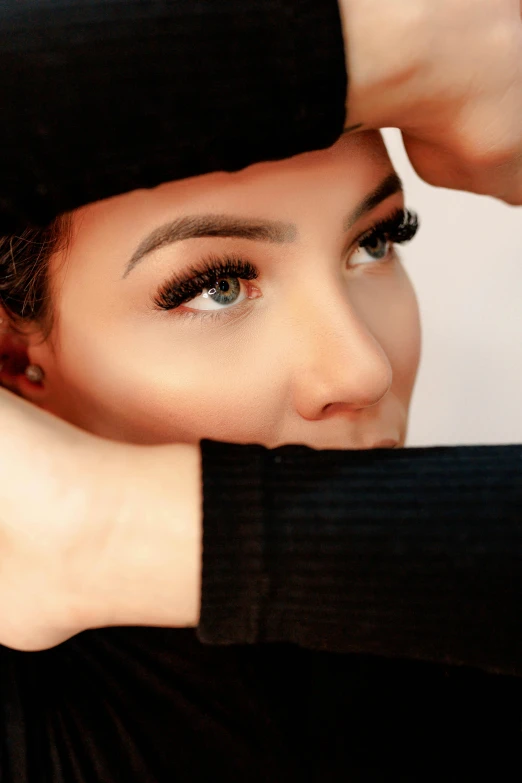 woman with eyeliners with dark hair posing for camera