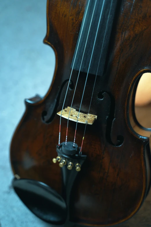 a violin is sitting upright on a table