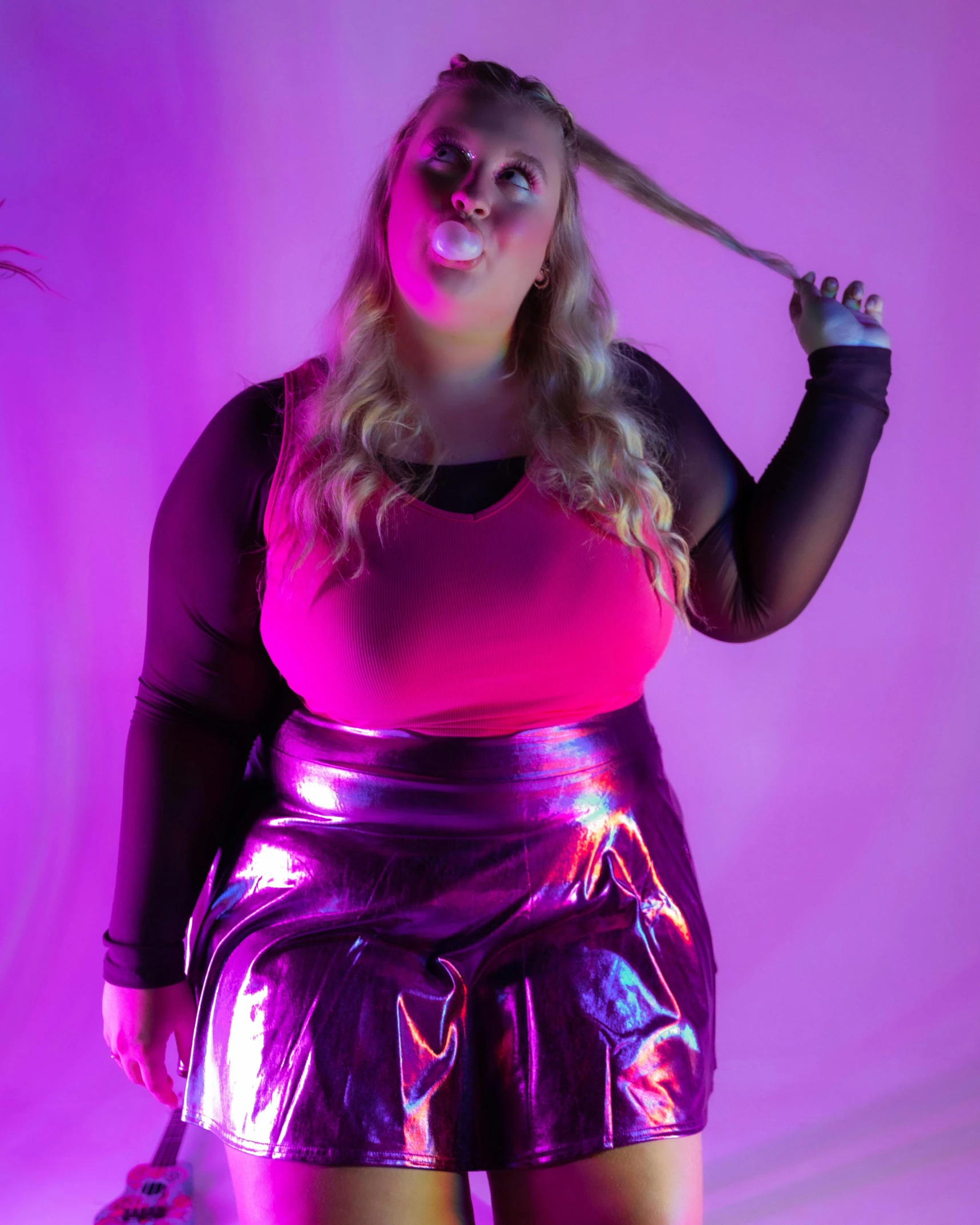 a woman posing with a large hairbrush in a room