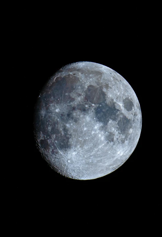 the full moon is pictured in a clear sky