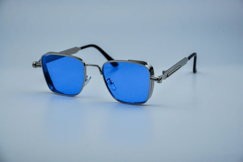 sunglasses with blue tinted glass, on white background