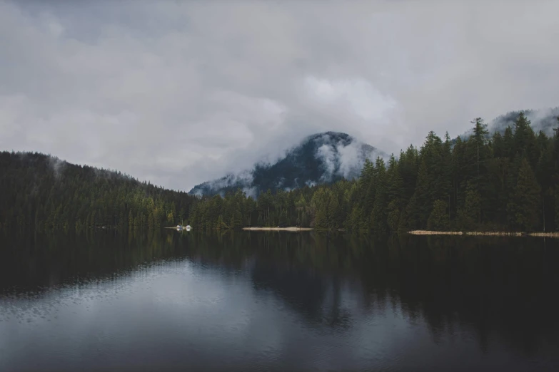 a mountain range in the distance with a body of water