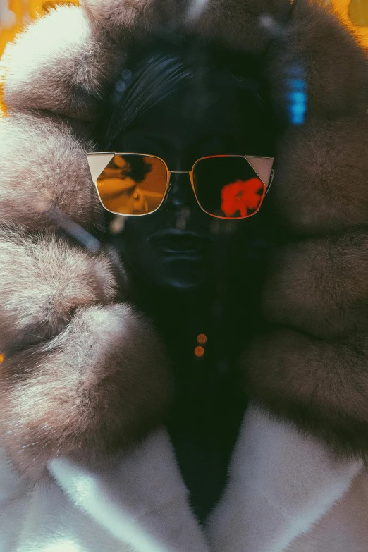 a po of a person with sunglasses and fur coat