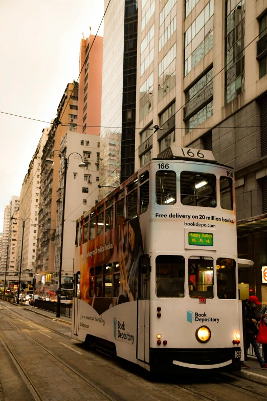 a city bus travels on a city street