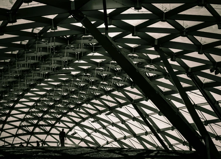 a man and woman standing inside a covered structure