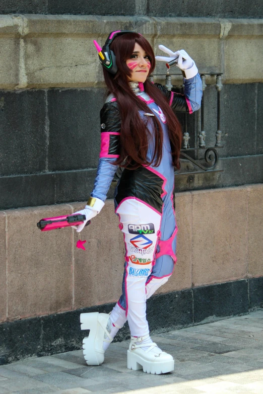 a woman in a costume posing in front of some stairs