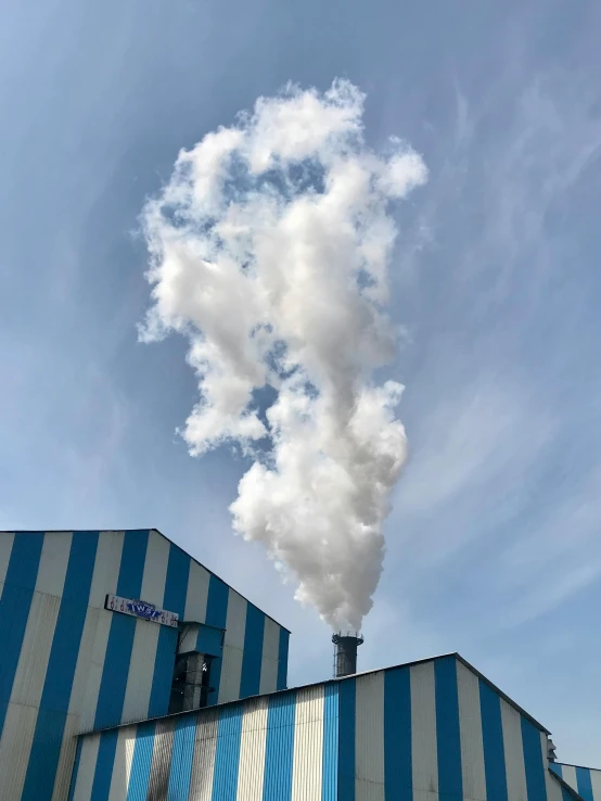 an industrial smoke stack emits from it